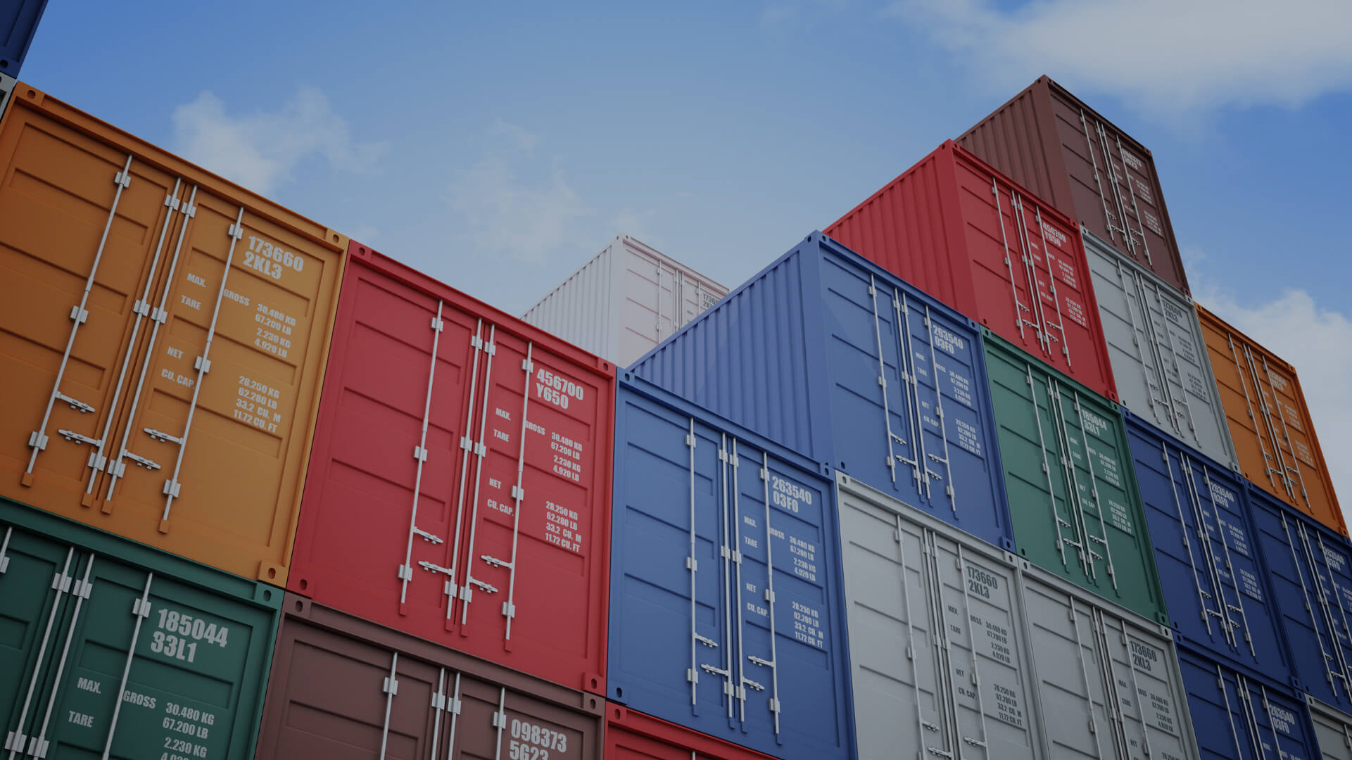 A stack of shipping containers is prepared for shipment to Asia.